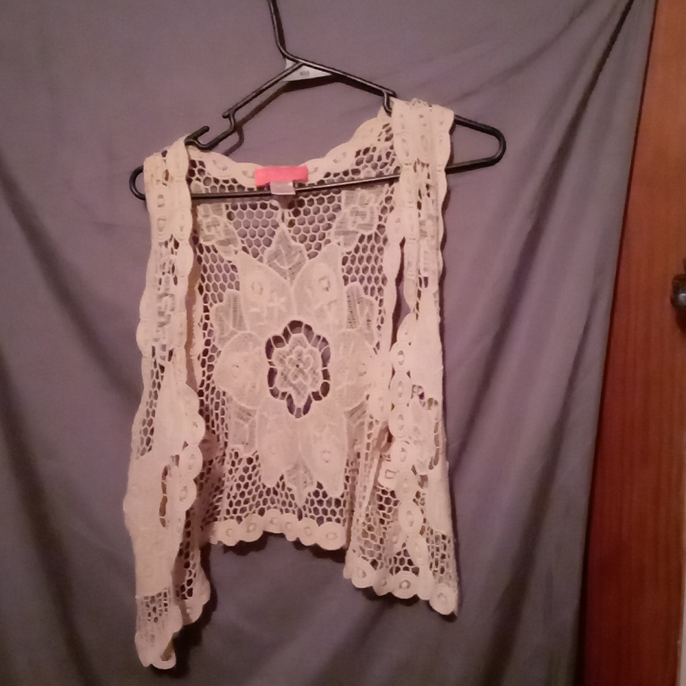 This is a two-piece outfit size small cream color